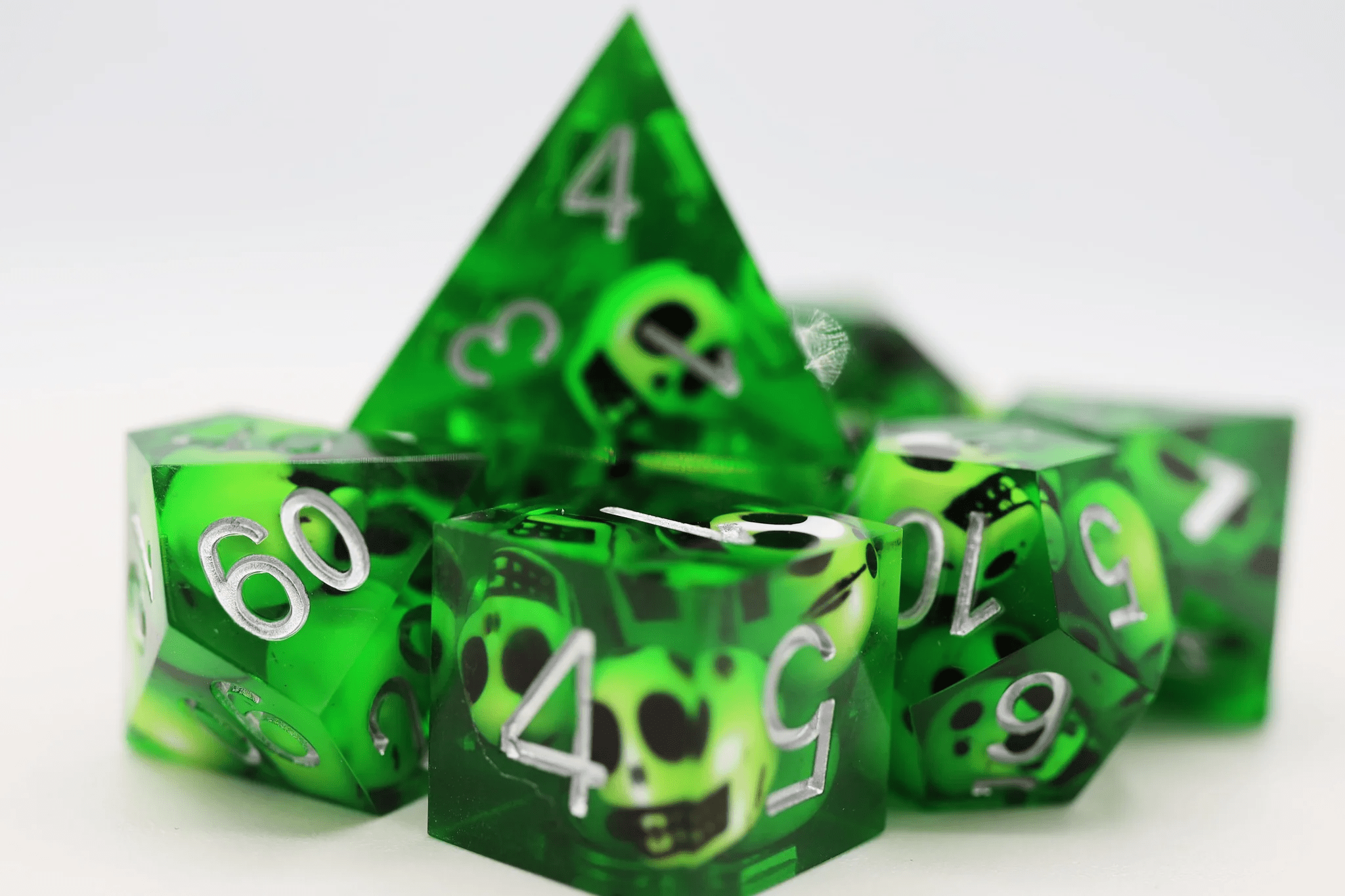 Foam Brain Games - Sharp Edge Resin RPG Dice Set: Green Skulls - The Feisty Goblin Gamehouse -