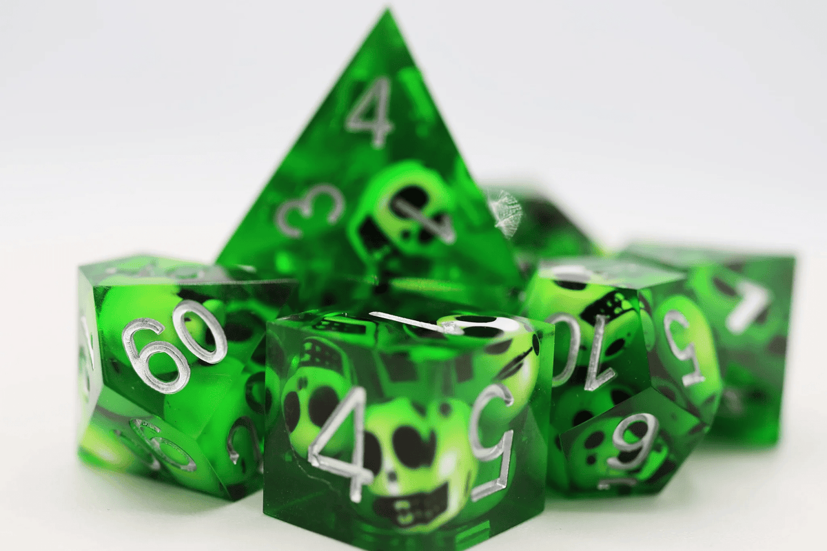 Foam Brain Games - Sharp Edge Resin RPG Dice Set: Green Skulls - The Feisty Goblin Gamehouse -