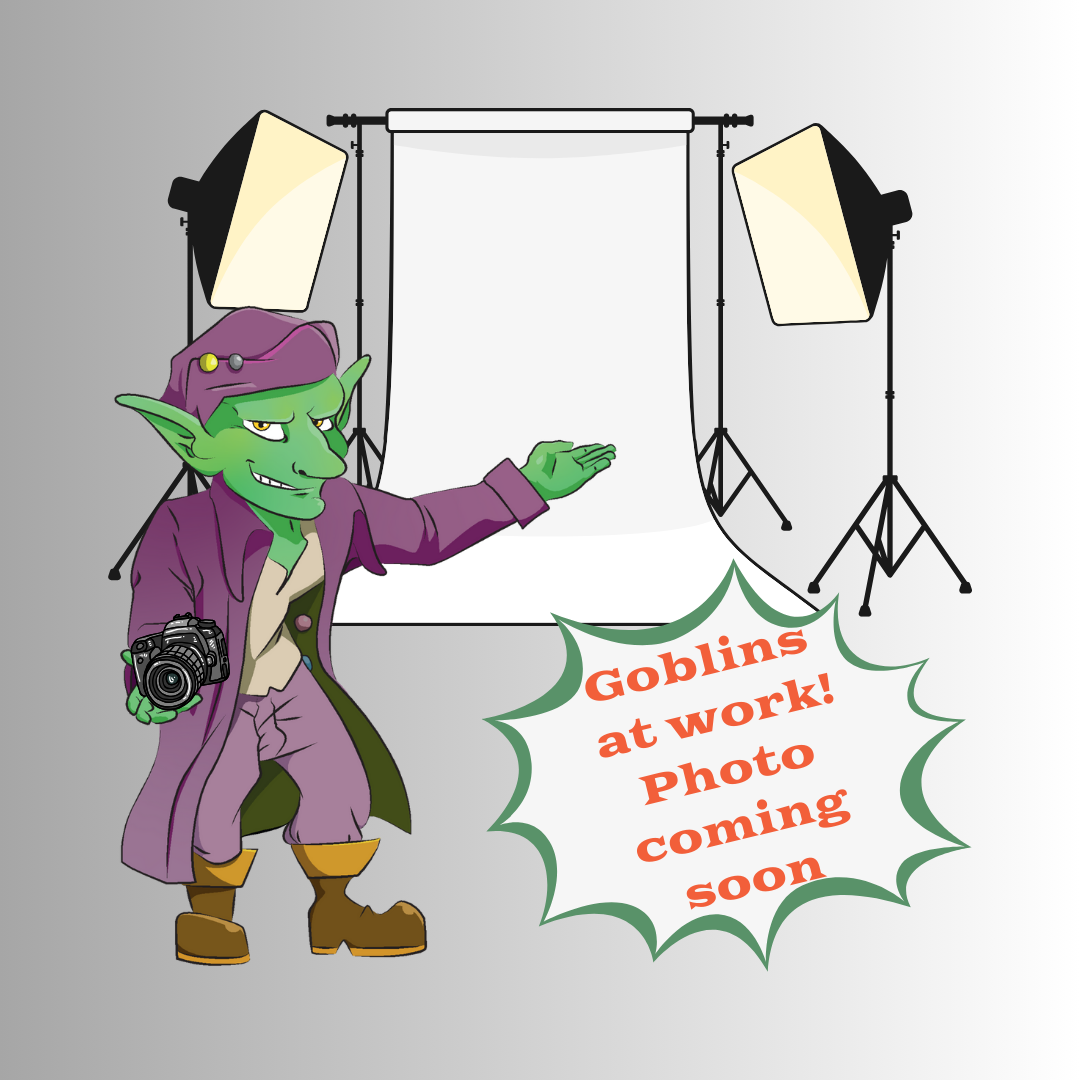 Cartoon goblin in a studio setting with photography equipment and text 'Goblins at work! Photo coming soon'.